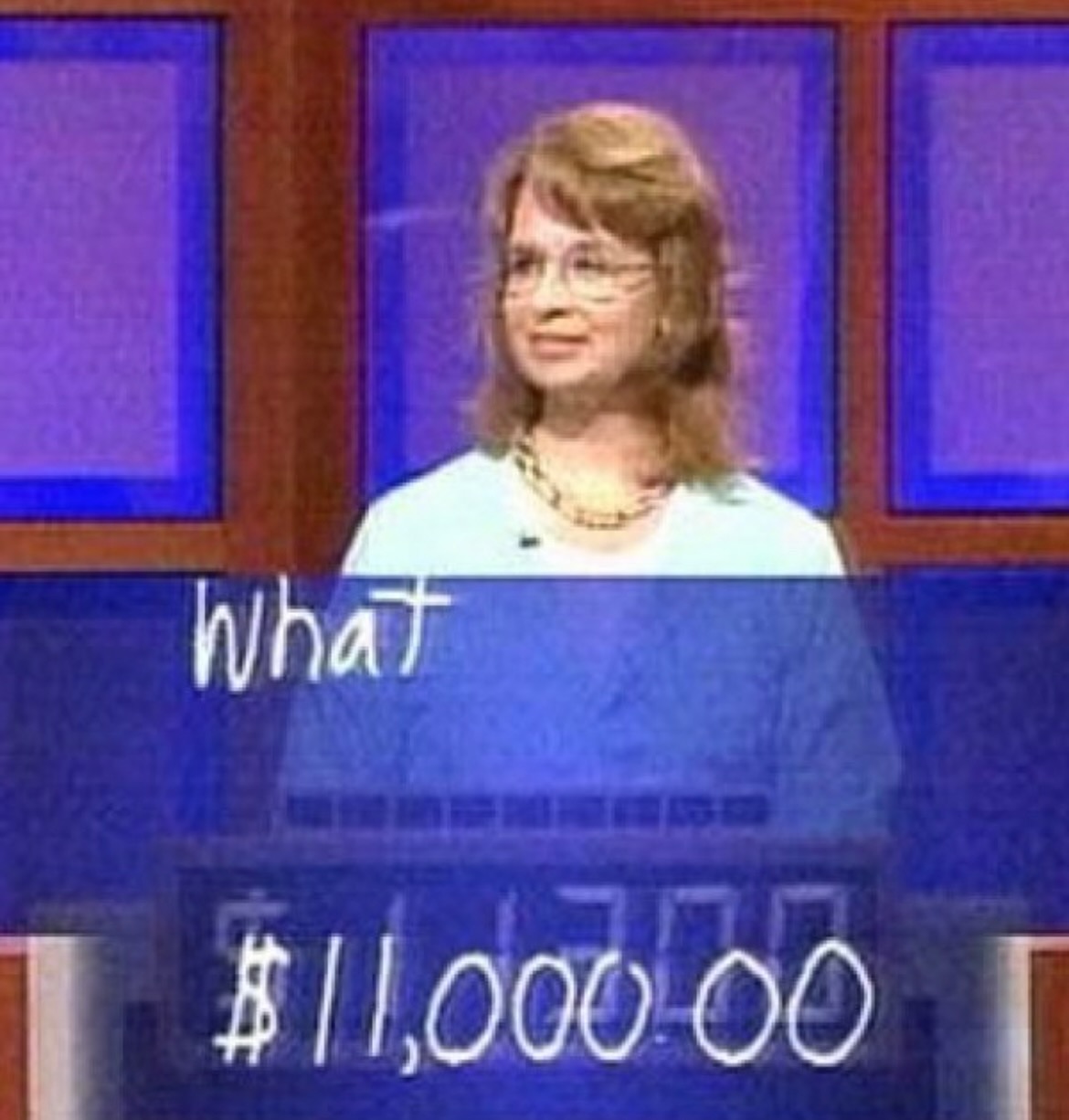 Jeopardy! Final Jeopardy: a contestant at the lectern with the handwritten response “What” and a wager of $11,000 on the display.